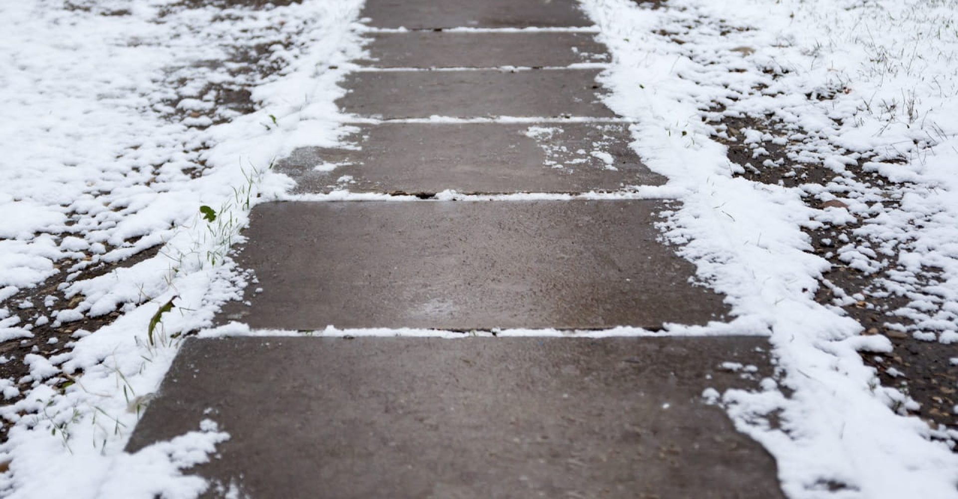 Pavers vs Concrete in a Minnesota Winter: What Lasts, What Shifts, and What to Fix in Spring